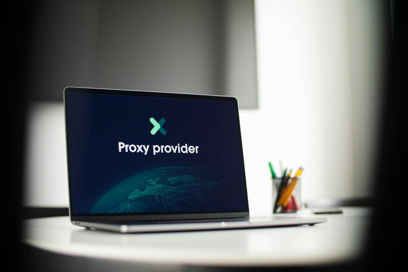 Laptop screen showing 'Proxy provider' in a tech office setting, focus on cybersecurity.